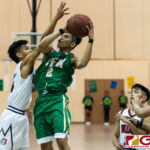 JFK Islanders King Karl De Mesa dribbles his way into close range for a shot at the basket. (Photo by Michael Blas)