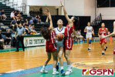 St. Paul Warrior Jan Quintanilla gets doubled on a drive towards the basket. (Photo by Michael Blas)