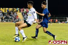 JFK Islander Justin Cruz reverses direction while Harvest Eagle Stephen Tomasiak stays on him. (Photo by Michael Blas)