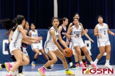 Academy Cougar Maria Taitano passes the ball around in the fourth quarter of the game. (Photo by Michael Blas)