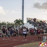 This Friday's IIAAG Track & Field Meet moves to the ocean scenery of J.F.K High. The sweltering heat was on but the fans and athletes still put on a show. (photo by Bout It Productions)