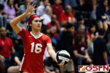 St. John's Knight Angeline Del Carmen prepares to serve in the third set of the game. (Photo by Michael Blas)
