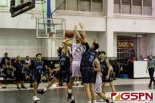 Southern Dolphin Craig Vegafria gets a block on Sanchez Shark James Edillor. (Photo by Michael Blas)