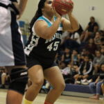 Cristirose Cruz heads to the free throw line for the Dolphins in the first half. (photo by Robert Balajadia)