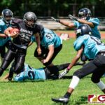 Sanchez Shark Joshua Sablan slips past two Southern defenders for positive yardage on the play. (Photo by Michael Blas)