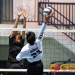 Jose Rios Voyagers Michael Quinata attempts to a kill shot while Untalan Wildcats Daniel DelaRosa leaps up to block. (Photo by Michael Blas)
