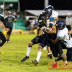 JFK Islander's HB Deante Delgado gets swarmed by the Guam High Panther's defense. (Photo by Michael Blas)