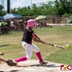 Queen B's Veronica Ignacio connects with the ball in the first inning of their APL Women's Softball game against Neni B's. (Photo by Michael Blas)