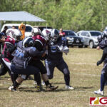 Team Legacy Samantha Frias hustles through the Island Stunnerz defense for positive yardage. (photo by Bout It Productions)