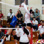 ND Royal Austia Mendiola gets up for a spike while St. John's Knight Angeline Del Carmen contests. (Photo by Michael Blas)