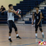 St. Paul Warriors Ralph Formoso connects with the ball off an Okkodo serve early in the first set. (Photo by Michael Blas)