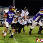 GW Gecko RB Aiden Gumataotao brushes off Islander Kyler Aguon for a first down. (Photo by Michael Blas)