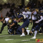 Tiyan High Titans Jaython Cruz gets taken down by the Panthers defense. (photo by Bout It Productions)