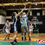 St. Paul Warriors Tiffani Lopez goes in for the layup as Academy Cougars Mia San Nicolas contests. (Photo by Michael Blas)