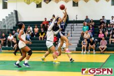Academy Cougar Maria Taitano gets her shot off on a fast break in the second quarter. (Photo by Michael Blas)