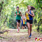 GW Gecko Gissa Dumaraog exits the jungle while Gecko and Islander runners trail. (Photo by Michael Blas)