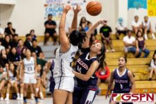 Okkodo Bulldog Anyanette Ponce gets fouled on a block on Academy Cougars Alura Hernandez. (Photo by Michael Blas)