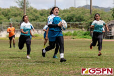 Academy Cougar Linda Camacho broke through the Southern Dolphin defense for a run to the try zone. (Photo by Michael Blas)