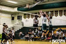 Tiyan Titans Dewayne Ngirarikl slams the ball through two Islander defenders. Photo by Bout It Productions