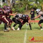 Simon Sanchez Shark's Running back and Father Duenas Friar's Nate Pinaula clash helmets late in the fourth quarter. (Photo by Michael Blas)