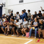 Okkodo Bulldog fans cheer as their team scores with a foul from the St. Paul Warriors. (Photo by Michael Blas)