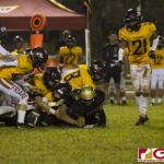Both teams scramble for the loose ball after it falls out the hands of Tiyan Titans Christopher Cowart. (photo by Bout It Productions)