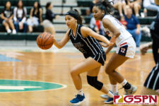 St. Paul Warrior Kayla Senne runs the play in the third quarter of the game. (Photo by Michael Blas)