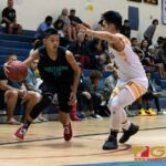 Southern High Dolphins Kyler Aflleje maintains possession of the ball as he looks to set up the play. (Photo by Michael Blas)
