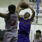 GW's Ron Shimizu rises up for a jumper in the lane against Shark Harold Gaerlan. (photo by Robert Balajadia)