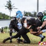 Hal's Angels Noah Medler gains yardage while protecting the pigskin from the defense. (photo by Bout It Productions)