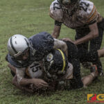 Tamuning Steelers Julian Bamba gets taken down on the sidelines by Guam Raiders Ryan Blas. (photo by Bout It Productions)