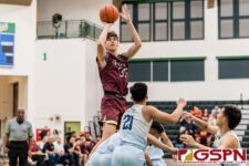 FD Friar Matthew Fegurgur gets over the St. Paul Warriors for a shot at the basket. (Photo by Michael Blas)