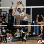 Harvest Eagles Jacob Oshiro connects with a spike while Titans Trevor Martinez contests. (Photo by Michael Blas)