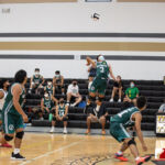 Jfk Islander Mark Morales gets some air time against the Tiyan High Titans. Photo by Bout It Productions