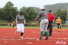 JFK's Kiyonii Yamaguchi is celebrated at home after hitting a two-run home run in the 2nd inning. (photo by Robert Balajadia)