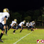 The Tiyan Titans kick off to start their game against the Simon Sanchez Sharks at Okkodo Saturday evening. (Photo by Michael Blas)