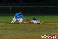 GW Gecko Javen Pangelinan slides into second base before ND Royal Guifon Terlaje can make the tag. (Photo by Michael Blas)