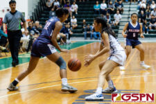 Academy Cougar Cori-Nicole Paulino attempts a steal on Okkodo Bulldog Amarya Fontanilla. (Photo by Michael Blas)