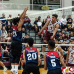 FD Friars Brian Anderson spikes through Bulldogs Jessie Martin in the early half of set two. (Photo by Michael Blas)