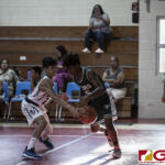 St. John Knights Alexander Kamai goes in for the steal against San Vicente Braves Jamarion Santiago. (photo by Bout It Productions)