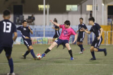 Lots of Art Tattoo Heat's Eddie Lee Lorenzo (in pink shirt) and Manhoben Lalahi's Matthew Iseke battle for possession of the ball during a Week 11 match of the Budweiser Soccer League Premier Division Friday at the Guam Football Association National Training Center. Manhoben Lalahi defeated LOA Heat's 9-4.