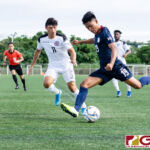 Philippines Yrick Gallantes gets ready to send the ball into the box while Guam Matao's Dylan Naputi pressures. (Photo by Michael Blas)