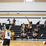 Tiyan High Titan VJ Rosario slams the ball to the awaiting Jfk Islanders. Photo by Bout It Productions