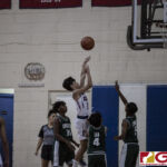 St. John Knights Alexander Kamai attempts his shot with three San Vicente Braves surrounding him. (photo by Bout It Productions)
