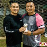 General Manager of APL Charlie Hermosa presents the third place trophy to Head Coach Russell Maratita of Team ADZtech. (Photo by Michael Blas)