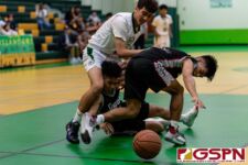 Sanchez Shark Ejan Sanchez and JFK Islander Dean Weilbacher chase down a loose ball. (Photo by Michael Blas)