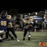 Guam High Panthers Jayson Jackson carries the pigskin for extra yardage. (photo by Bout It Productions)