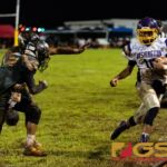 GW Geckos Enrique Macias scrambles and gets the first down as he runs out of bounds. (Photo by Michael Blas)