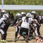 Sindalu Raiders Miara Leon Guerrero pushes through Team Legacy's defense. (photo by Bout It Productions)