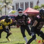Vandrew Naputi carries the ball looking for an opening from the defense. (photo by Bout It Productions)